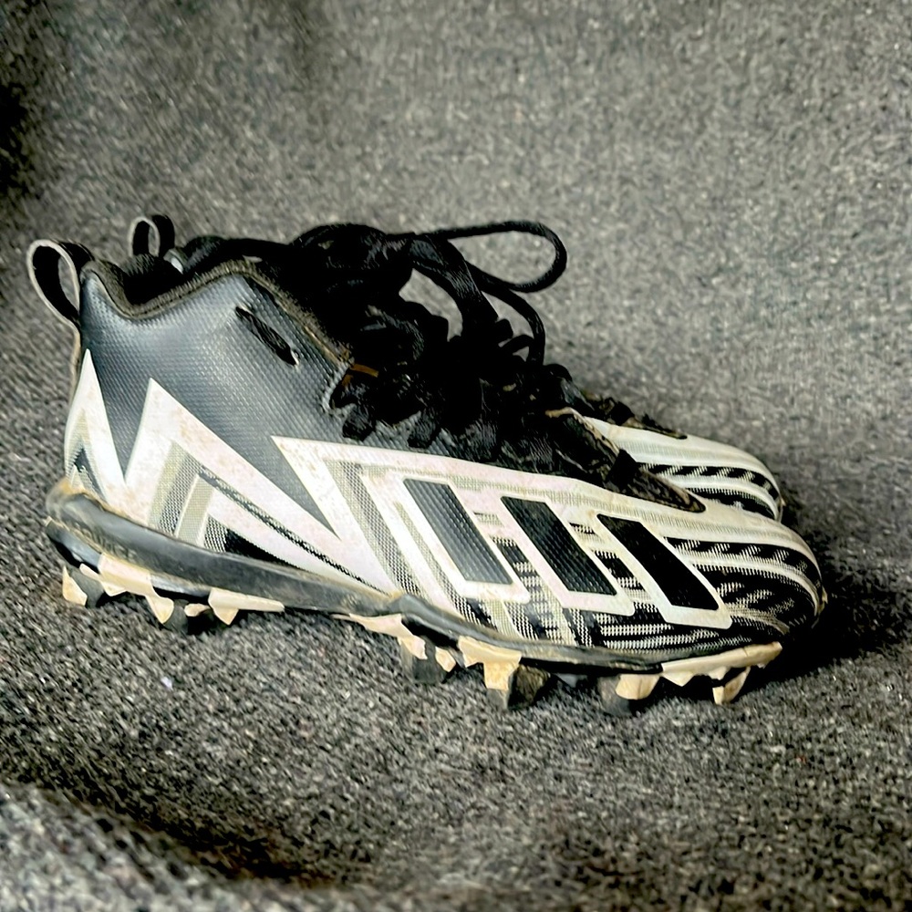 Size 4 little kids Adidas black and white freak spark football cleats